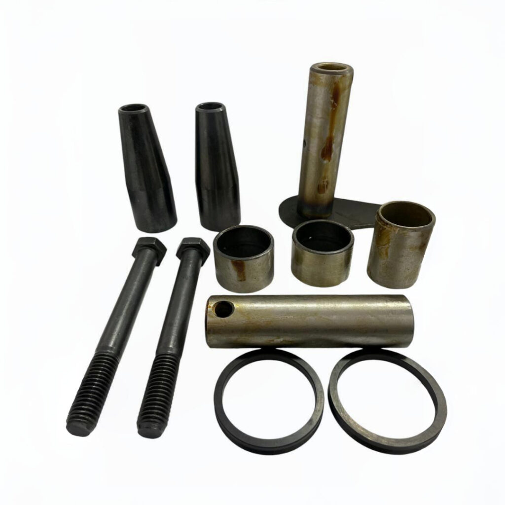 Pinos e buchas da articulação – Garantem o alinhamento e o movimento correto dos braços da máquina, reduzindo folgas, desgaste e evitando quebras ou paradas inesperadas.